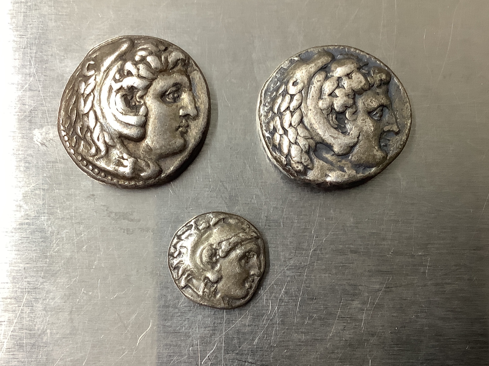 Two AR Tetradrachms, 17.2g, 23mm and 17.3g, 23mm and an AR drachm, 4.1g, 0.6mm, all with Head of Herakles right, wearing lion skin headdress / Zeus Aëtophoros seated left, holding sceptre; A?E?AN?POY to right